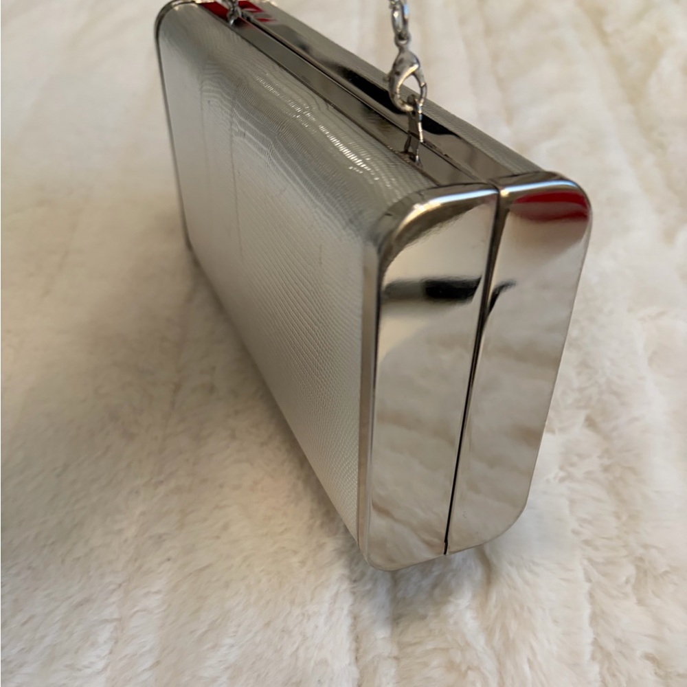 Elegant Silver Clutch with Tassel